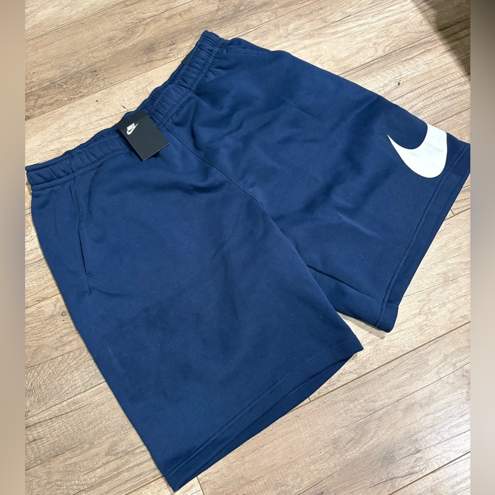 Blue Nike fleece shorts .